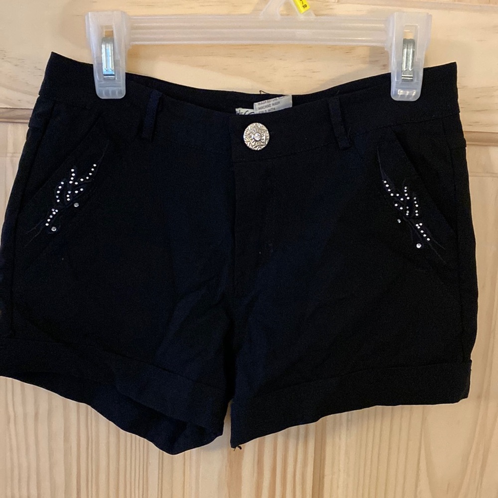 Black bedazzled short shorts.